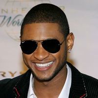 Usher, amenintat de Chris Brown
