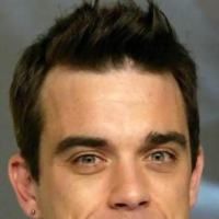 Robbie Williams va canta, in direct, pentru romani